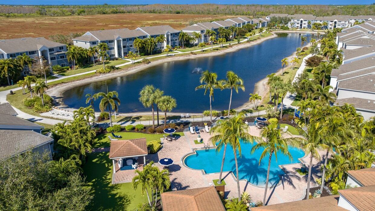 Enjoy a stunning aerial view of our community, offering resort-style amenities, picturesque waterfront views, and a tranquil atmosphere. - Lexington Palms at the Forum