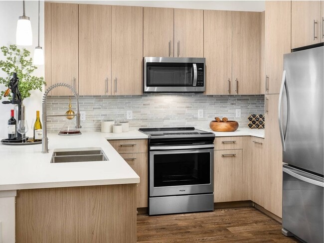 Counter on both sides of the electric range gives prep space to work. - Siena Tuscan Village