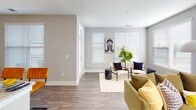 This single-story residence at 2815 Capital Blvd in Raleigh, North Carolina offers a thoughtfully designed layout with multiple bedrooms and bathrooms, combining modern finishes with a cohesive contemporary aesthetic. The open-concept living and dining area features wood-style plank flooring, neutral gray walls, and multiple windows fitted with blinds that allow generous natural light to fill the space. The kitchen is a standout feature, showcasing light wood cabinetry, granite countertops, stainless steel appliances, and a large island with pendant lighting overhead — ideal for both cooking and casual dining.

The bedrooms are carpeted for comfort and each receives natural light through well-positioned windows. The primary bedroom connects to an en suite bathroom equipped with a glass-enclosed walk-in shower, granite vanity, wood-style flooring, and access to a dedicated walk-in closet. A secondary bathroom mirrors the same refined finish level, featuring a granite-topped vanity and hardwood-style floors.

Throughout the residence, the design maintains a consistent modern palette — neutral tones, clean lines, and quality materials — creating a calm, cohesive ambiance. An in-unit laundry area adds practical convenience to this well-appointed Raleigh home.