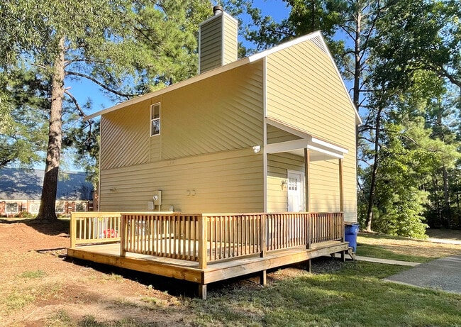 Back of house with porch - 8300 Scottingham Dr