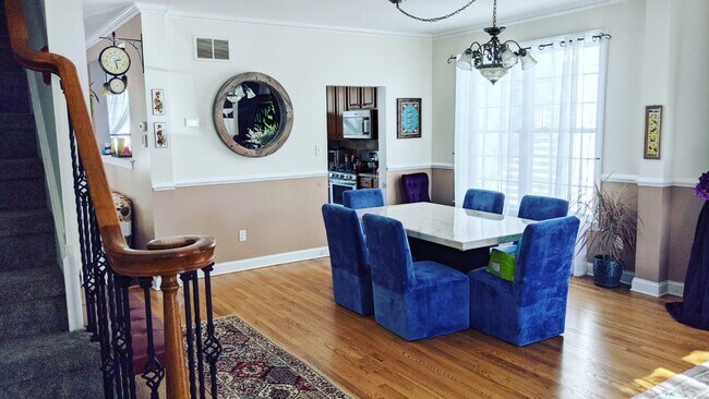 Dining room with marble table and rolling chairs - 1273 Park St
