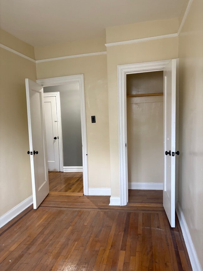 Otherside of room. Entry door, and closet door - 54 E Clifford Pl