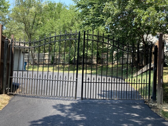 Gate to garage and fully fenced large back yard - 13820 Johnson Dr