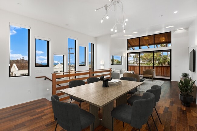 Dining area and living space with peak ocean views. Virtually staged. - 4640 Del Monte Ave