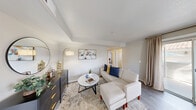 Located at 3300 Winterhaven St in Las Vegas, NV, this well-appointed one-bedroom, two-bathroom home offers a thoughtfully designed single-floor layout that maximizes every inch of its space. The open living area features wood-look flooring, neutral tones, and a tray ceiling detail that adds architectural interest, creating a welcoming and functional gathering space. Natural light filters in through draped windows, enhancing the bright and airy ambiance throughout.

The kitchen is a standout, outfitted with white shaker-style cabinetry, granite countertops, a yellow subway tile backsplash, and white appliances including a full-size refrigerator, range, microwave, and dishwasher. An arched window above the sink brings in natural light, adding charm to this efficient cooking space.

The bedroom is a comfortable retreat featuring wood-look flooring, a ceiling fan, a natural light-admitting window, and a sliding-door closet with built-in shelving. A dedicated office with its own ceiling fan and window provides an ideal space for remote work or study.

Both bathrooms are clean and functional, one featuring a granite-topped vanity with white cabinetry, and the other a walk-in shower with tiled surrounds and built-in shelving. This home offers a practical and comfortable lifestyle in a convenient Las Vegas location.