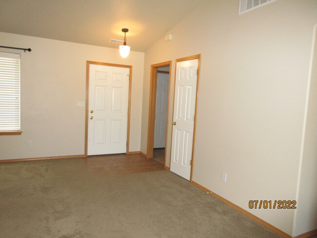 entry, closet, door to laundry and garage - 1802 N Aladdin Rd