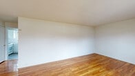 Located at 29 Iozia Terrace in Elmwood Park, NJ, this one-bedroom, one-bathroom unit offers a practical and well-organized single-floor layout. Warm hardwood flooring runs throughout the living areas and bedroom, adding a classic and cohesive look to the space. The living room is bright and open, with natural light filtering in through a window, and offers generous room for comfortable furnishings. The bedroom is a well-proportioned private retreat, featuring a large window, a classic cast-iron radiator, and gleaming hardwood floors. A notable feature of this unit is its impressive five closets, providing exceptional storage throughout. The kitchen has been thoughtfully updated with white shaker-style cabinetry, light quartz countertops, a subway tile backsplash, stainless steel sink, and white appliances including a gas range with overhead microwave. A window above the sink brings in natural light. The bathroom is clean and functional, finished in white tile with a shower/tub combination, a vanity with medicine cabinet mirror, and a frosted window for privacy and ventilation. The unit's crisp white walls throughout create a bright, neutral backdrop ready for personalization.