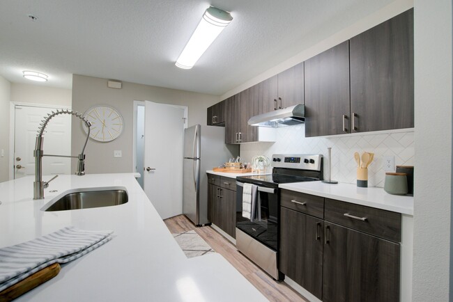 Kitchen with Stainless Steel Appliances - Rocky Creek Apartments