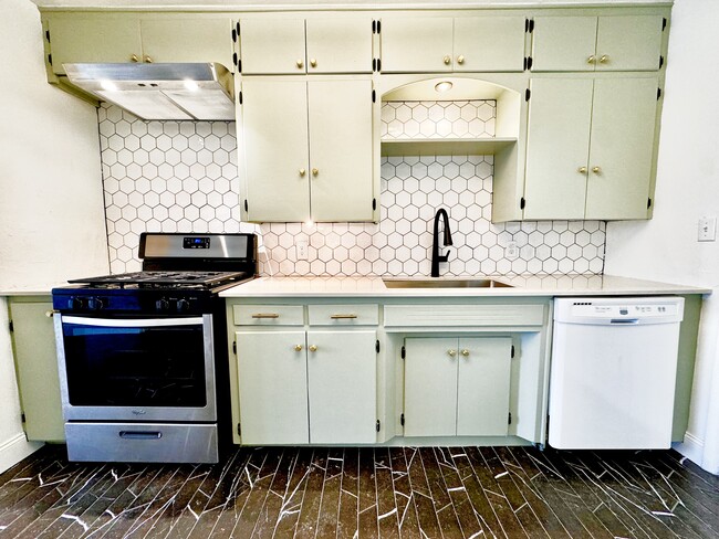 Premium hexagon tiles adorn the kitchen backsplash - 2710 NW 57th St