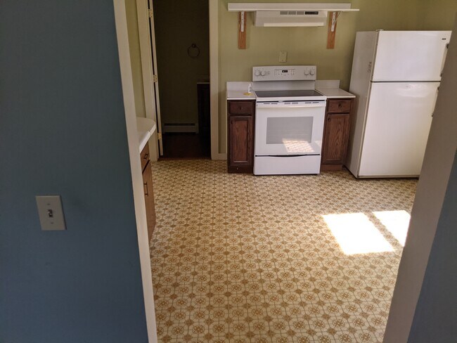 New kitchen floor being put in. - 10 Arbor St