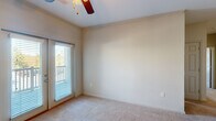 Located at 601 Giddings Court in Augusta, Georgia, this single-story, three-bedroom, two-bathroom home offers a well-organized and functional layout. The kitchen is a standout feature, showcasing rich dark wood cabinetry, dark countertops, black appliances, and a breakfast peninsula that opens to the living area — all illuminated by track lighting overhead. The seamless flow between the kitchen and living space creates an inviting, open feel underfoot with plush carpeting throughout.

The generously sized primary bedroom includes crown molding, a ceiling fan, natural light from a large window, and access to a spacious walk-in closet outfitted with wire shelving and hanging rods for ample storage. The two additional bedrooms are equally well-appointed, each featuring carpeted floors, ceiling fans, and windows that bring in natural light. The bathrooms are finished with dark wood vanities, gray countertops, and tile flooring for a clean, cohesive aesthetic.

A dedicated laundry room provides washer and dryer hookups along with overhead wire shelving and tile flooring, adding practical convenience. Three total closets across the home ensure excellent storage throughout. The thoughtful single-floor layout makes this home both accessible and efficient.