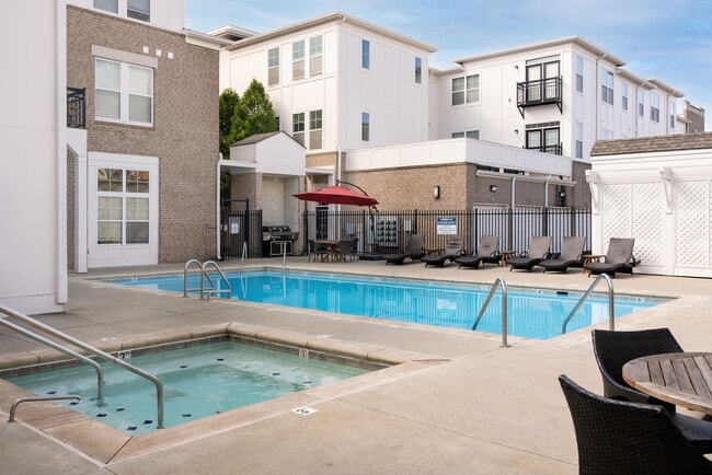 Sparkling Pool with Sundeck, Hot Tub, and Grilling Area - The Fort Apartments
