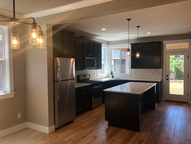 Building Photo - Beautiful New Home with Garage and Yard! A...