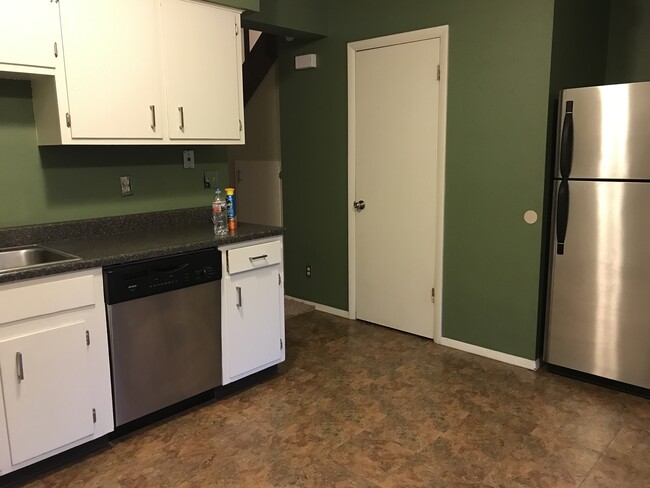 kitchen looking towards living (door is 1/2 bath) - new flooring coming - 1360 N 18th St