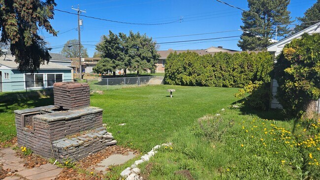 Building Photo - Great Shadle Home With Fenced Yard and Det...