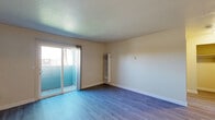 Located at 4550 Shelley Ct in Stockton, California, this one-bedroom, one-bathroom unit offers a practical and comfortable single-floor layout. The living room serves as the heart of the home, featuring smooth luxury vinyl plank flooring, neutral warm-toned walls, and a textured ceiling. Natural light filters in through a window, while a sliding glass door opens to an outdoor space, connecting the interior to the outside. A wall-mounted HVAC unit provides climate control throughout the living area.

The galley-style kitchen is efficiently designed with white cabinetry lining both sides, granite-look countertops, a double stainless steel sink, and tile flooring. Full-size appliances, including a refrigerator and electric range, are neatly integrated into the layout, maximizing functionality within the space.

The bedroom is a comfortable, well-proportioned room with the same LVP flooring found throughout, neutral walls, and access to a dedicated closet. The full bathroom is finished with warm earth-tone tile surrounding the tub-shower combination, a wooden vanity with granite-look countertop, and tile flooring, lending a clean and cohesive aesthetic. This unit offers a straightforward, move-in-ready living experience in a convenient Stockton location.