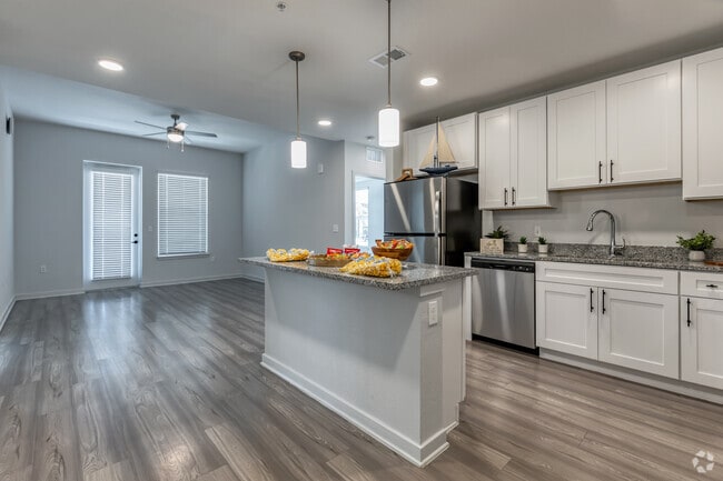 B1 - 2BR, 2BA - 1,080SF - Kitchen & Living Room - Lake Maggiore Apartments
