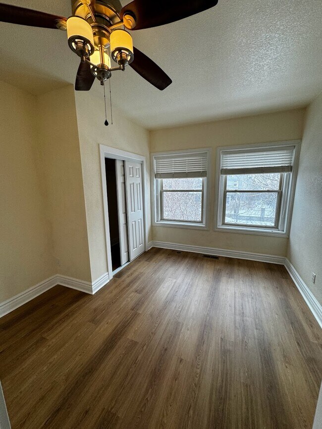 This bedroom would be yours, with a large closet and huge double-pane windows. - 1456 Pennsylvania St