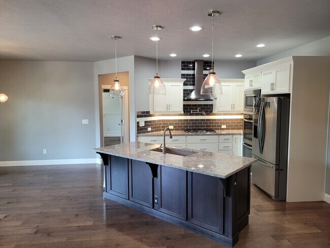 Beautiful designer island kitchen. - 10309 W Chino Dr