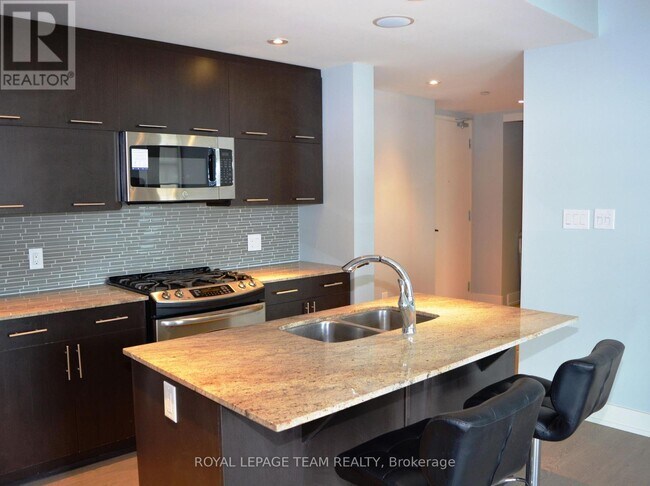 Building Photo - 100 Champagne Ave S