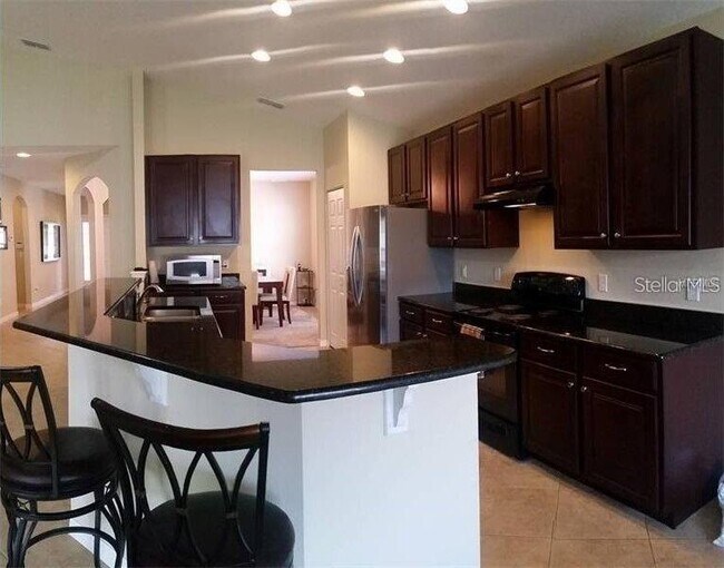 Foto del edificio - 10525 Cabbage Tree Loop