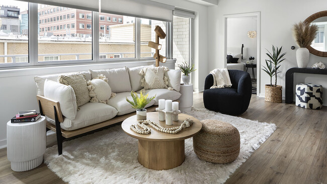 Apartment Living Room with wood floors. - Griffis LoDo