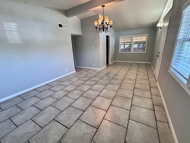 Building Photo - Charming 3-bedroom, 1-bath home featuring an attached carport and a fully fenced backyard—perfect...