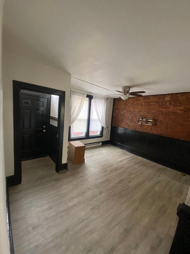 Living room and front door entryway room equipped with jacket and purse hooks, includes tv mount - 20 Conestoga St
