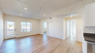 Located at 15528 Rayen St in Los Angeles, CA, this thoughtfully designed 2-bedroom, 2-bathroom unit offers a clean, modern aesthetic across a single floor. Light wood flooring runs seamlessly throughout, complementing the crisp white walls and creating a bright, cohesive look in every room. The living area is open and airy, featuring recessed lighting and windows that invite natural light and frame views of the surrounding neighborhood. The kitchen is well-appointed with white shaker-style cabinetry, dark countertops, a stainless steel gas range, dishwasher, and a built-in sink — offering both style and functionality in a compact, efficient layout. The primary bedroom provides a comfortable retreat with a large sliding-door closet, recessed lighting, and windows with outdoor views. The second bedroom is bright and versatile, bathed in natural light. Both bathrooms are finished in a clean, modern style; one features a full bathtub and shower combo with white tile surround, a vanity with white cabinetry, dark countertops, and wood-look flooring. The overall ambiance of the unit is fresh and move-in ready, with consistent finishes that lend a polished, contemporary feel throughout.