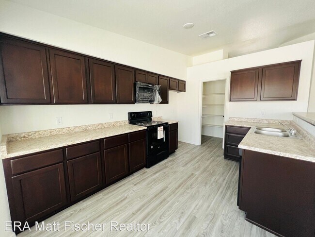 Building Photo - 4 br, 2 bath House - 7599 E. 43rd Pl.