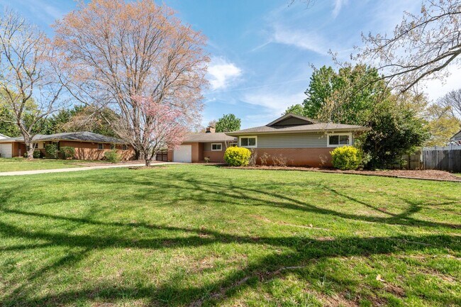 Building Photo - Your ideal Greenville home perfectly positioned between vibrant downtown Greenville and charming ...