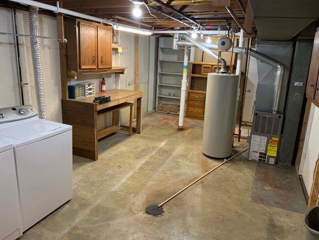 Unfinished basement utility, storage room, work bench - 11934 Holly Brook Dr