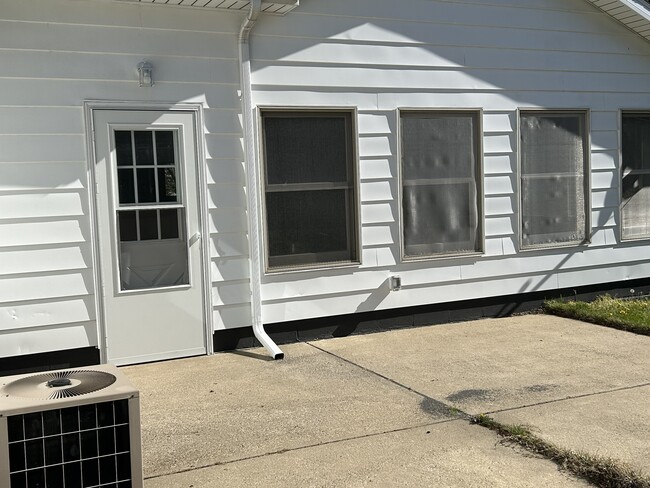 Side of Home with Cement Patio - 3383 Locust Ln