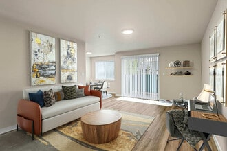 Spacious living room and dining nook in Foster Creek apartments, Tukwila, WA. - Foster Creek