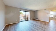 Located at 1120 Tall Oaks Cir in Harrison, Ohio, this 1-bedroom, 1-bathroom unit offers a clean, efficiently designed single-floor layout. Light-toned luxury vinyl plank flooring runs throughout the entire space, creating a cohesive and modern aesthetic.

The living room serves as the heart of the unit, highlighted by a large sliding glass door that opens onto a private balcony with outdoor views of the surrounding neighborhood and mature trees. A textured ceiling adds subtle character to the room, which receives generous natural light.

The kitchen is equipped with warm-toned wooden cabinetry, granite-look countertops, a stainless electric range, and an overhead ventilation hood — offering a practical and attractive cooking space. Additional storage is accessible via a nearby closet.

The bedroom is a comfortable, naturally lit room featuring a dedicated closet with a hanging rod, a window overlooking the exterior, and the same consistent LVP flooring. The space is served by two connecting hallways and benefits from a total of three closets throughout the unit.

The full bathroom includes a shower-tub combination, a wooden vanity with a white countertop, and matching LVP flooring, maintaining the clean, uniform look found across the rest of the home.