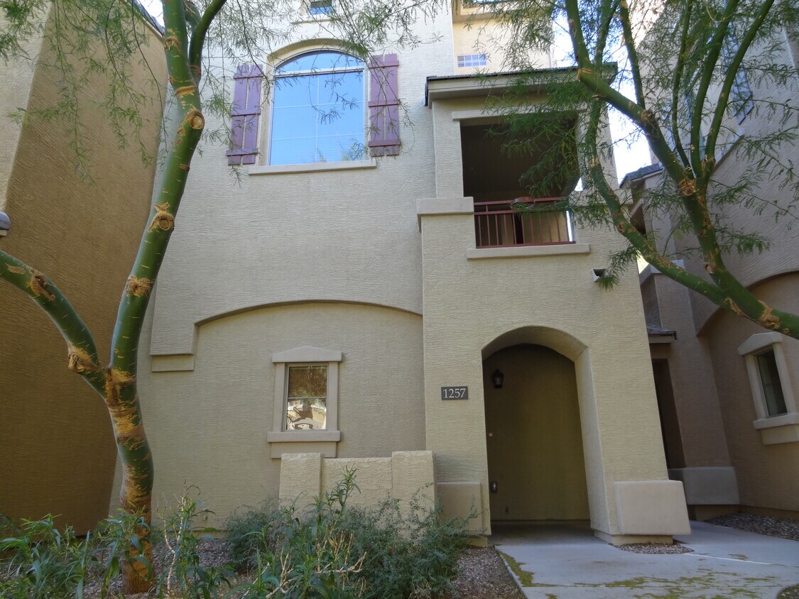 This is a three-level townhouse with a private entrance. - 240 W Juniper Ave
