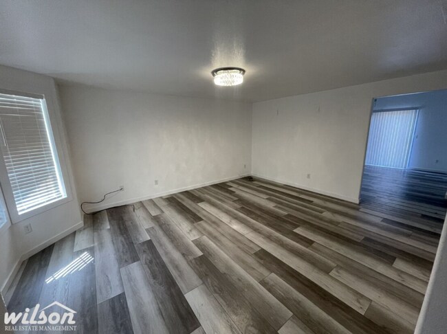 Building Photo - 3 Bed, 2 Bath Home with a Two-Car Garage, Fenced Backyard, and Lawn Care Included