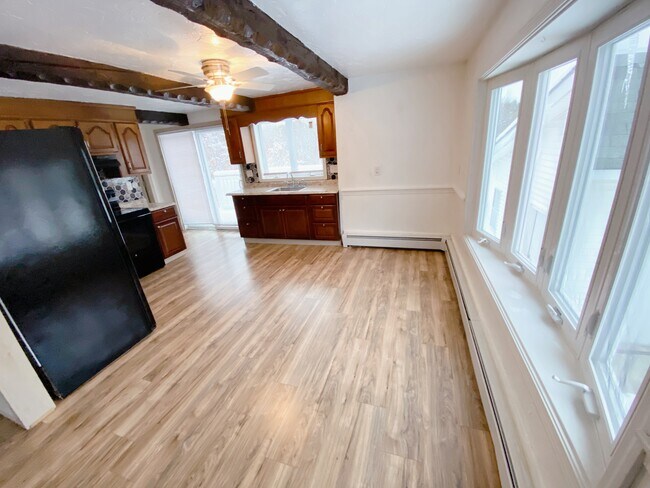Kitchen with Bay Window and Deck Sliding Door - 423 Main St