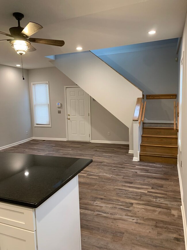 Kitchen and entryway with luxury flooring - 2605 W 11th St