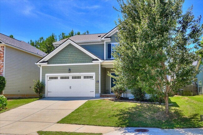 Building Photo - 4 bed/2.5 bath home with fenced yard and g...