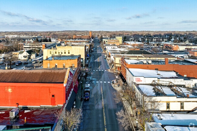 Storefronts full of restaurants and shopping in downtown Hopkins.