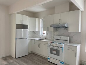 Building Photo - 7118-7110 10th Ave