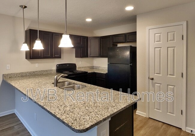 Building Photo - 5569 Cabot Dr N
