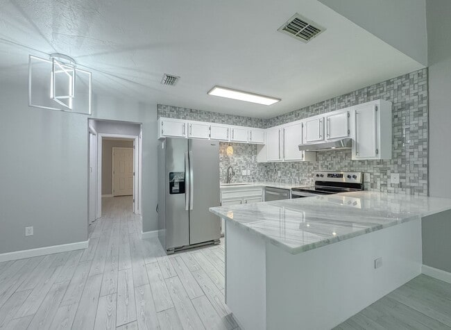 Photo - MODERN! Walk to FSU 2/2 w/ Marble Counters, Stainless Steel Appliances, & Privacy Fenced Yard! Av... Townhome