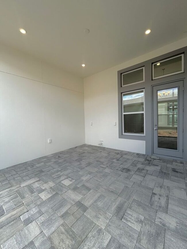 Building Photo - Gorgeous 4/3 Residence with a Private Back Lanai and a 3 Car Garage in the Delightful Laureate Pa...