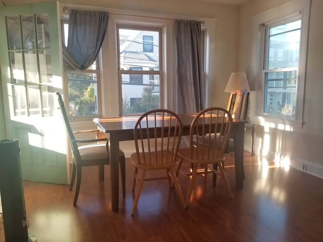 bedroom #1 used as dining room has access to the front balcony - 61 Hooker St