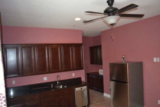 Kitchen with Refrigerator included - 2270 Valentano Dr Apartments