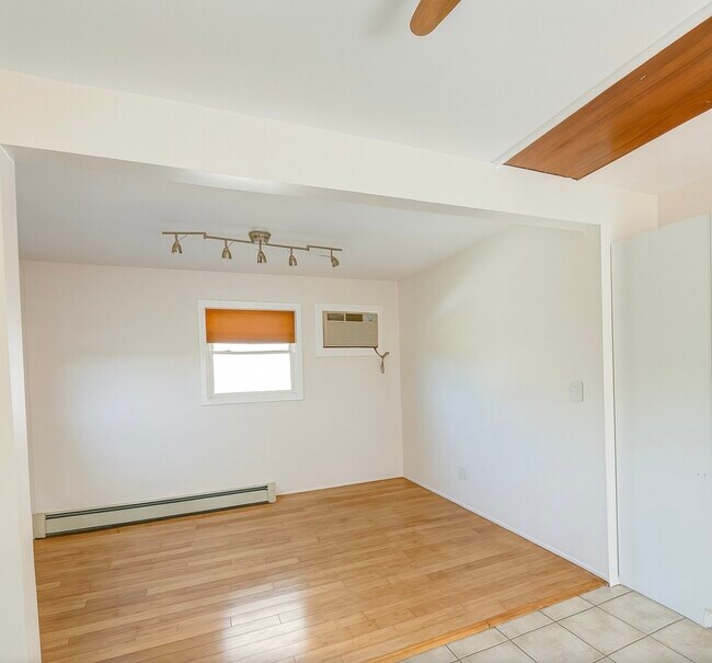 Living Room + Access to attic storage - 49 Maple St NE