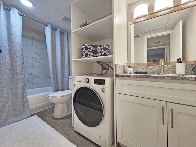 Bathroom with Granite Counters - Amalie Apartment Homes