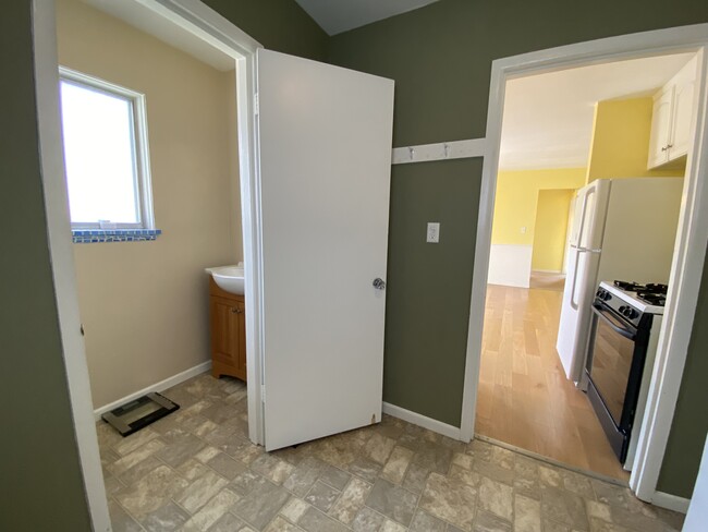 Side door entryway with 1/2 bathroom - 618 Clayton Ave NW